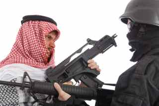 Middle East soldier holding machine gun